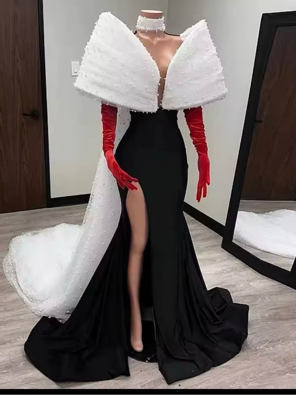 Elegant Black Evening Gown with White Pearl-Embellished Cape